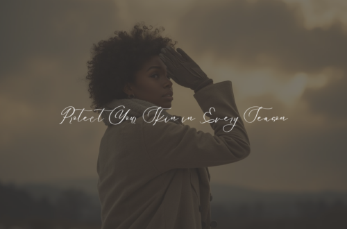 African American woman in winter clothing shielding her eyes from sunlight breaking through cloudy skies