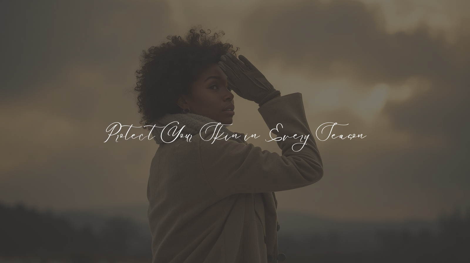 African American woman in winter clothing shielding her eyes from sunlight breaking through cloudy skies