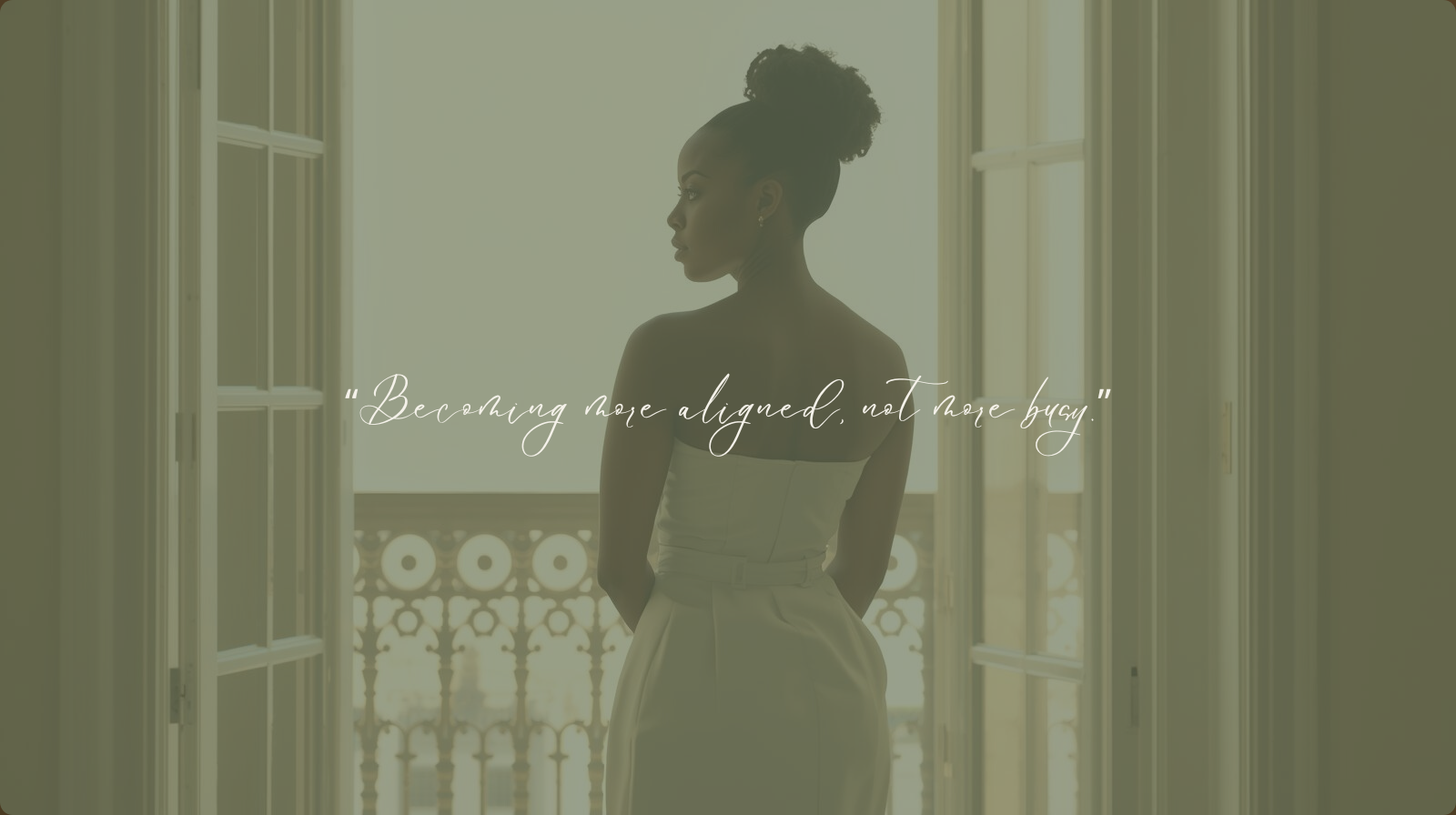 A woman standing in soft natural light, facing an open balcony, symbolizing personal growth, alignment, and intentional living.