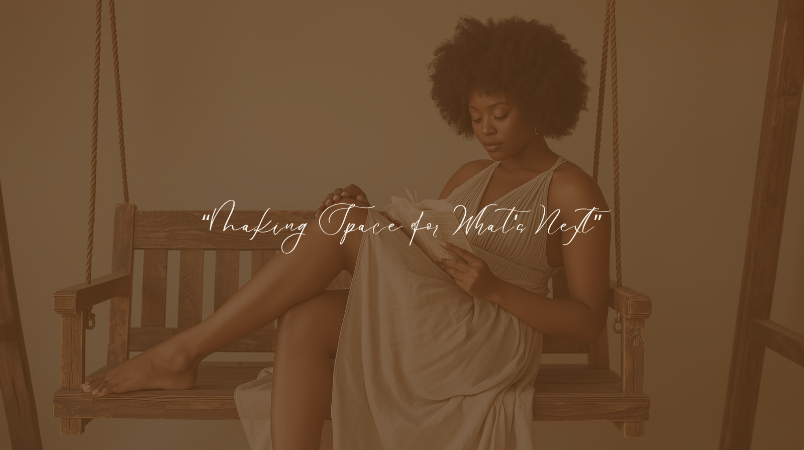 African American woman sitting on a wooden swing in a flowing dress, reading a book in soft natural light